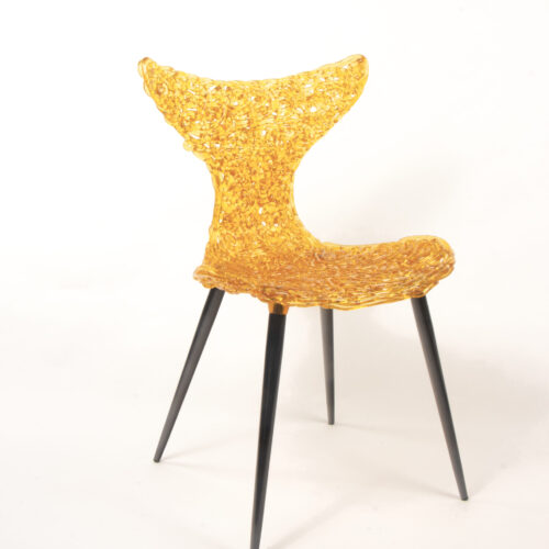 Innovative Chair inspired by fish movement with light-catching sculptural form